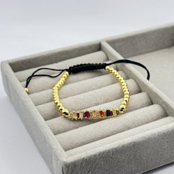 Bratara aurie pe snur negru