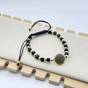Bratara pe snur cerat cu bilute negre si aurii