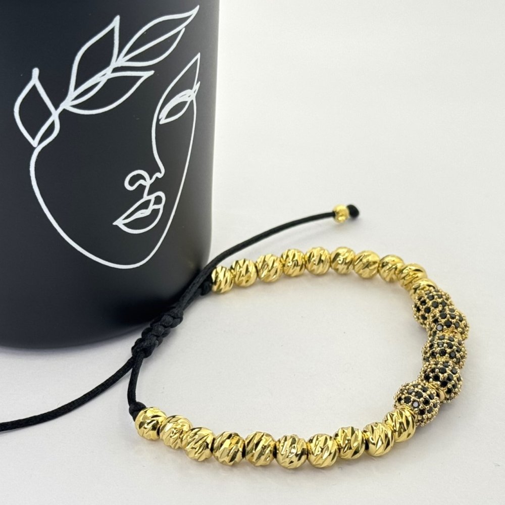 Bratara pe snur cu bilute aurii Bratara pe snur cu bilute aurii