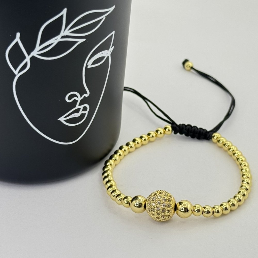 Bratara pe snur cu bilute aurii